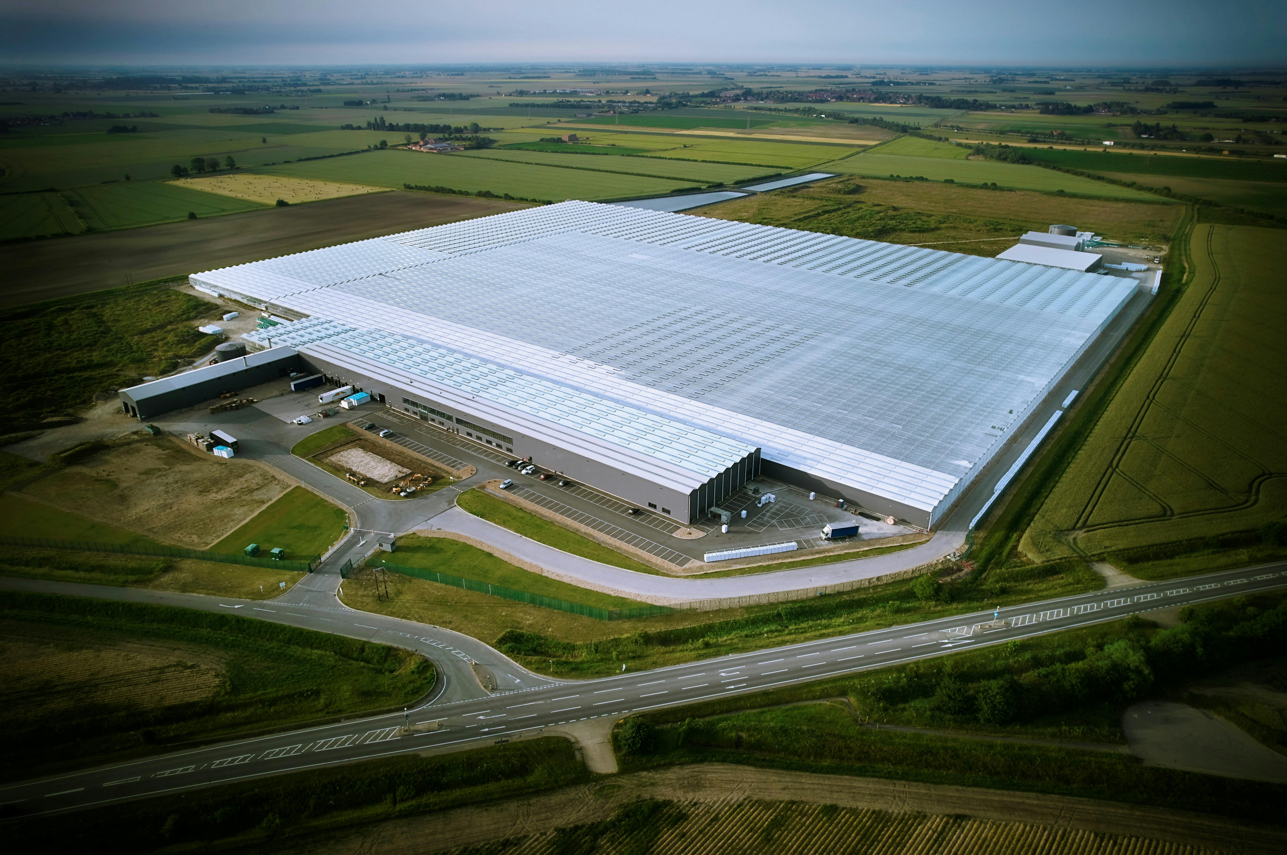 An arial shot of a large commercial greenhouse. Alan Boswell Group insurance brokers Supporting complex horticulture with expert advice at Bridge Farm Group