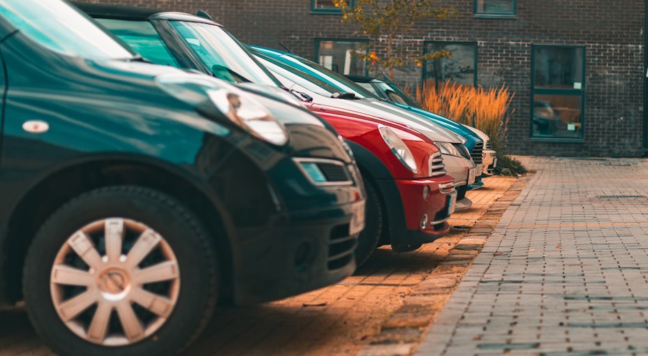 lots of cars lines up in a row for sale