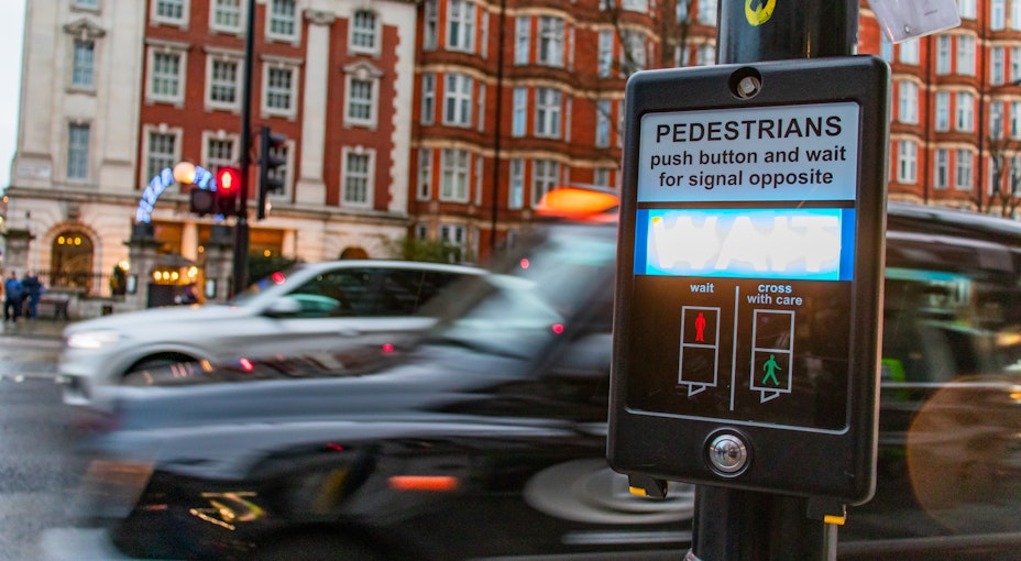 a busy road with a first time taxi driver driving a taxi