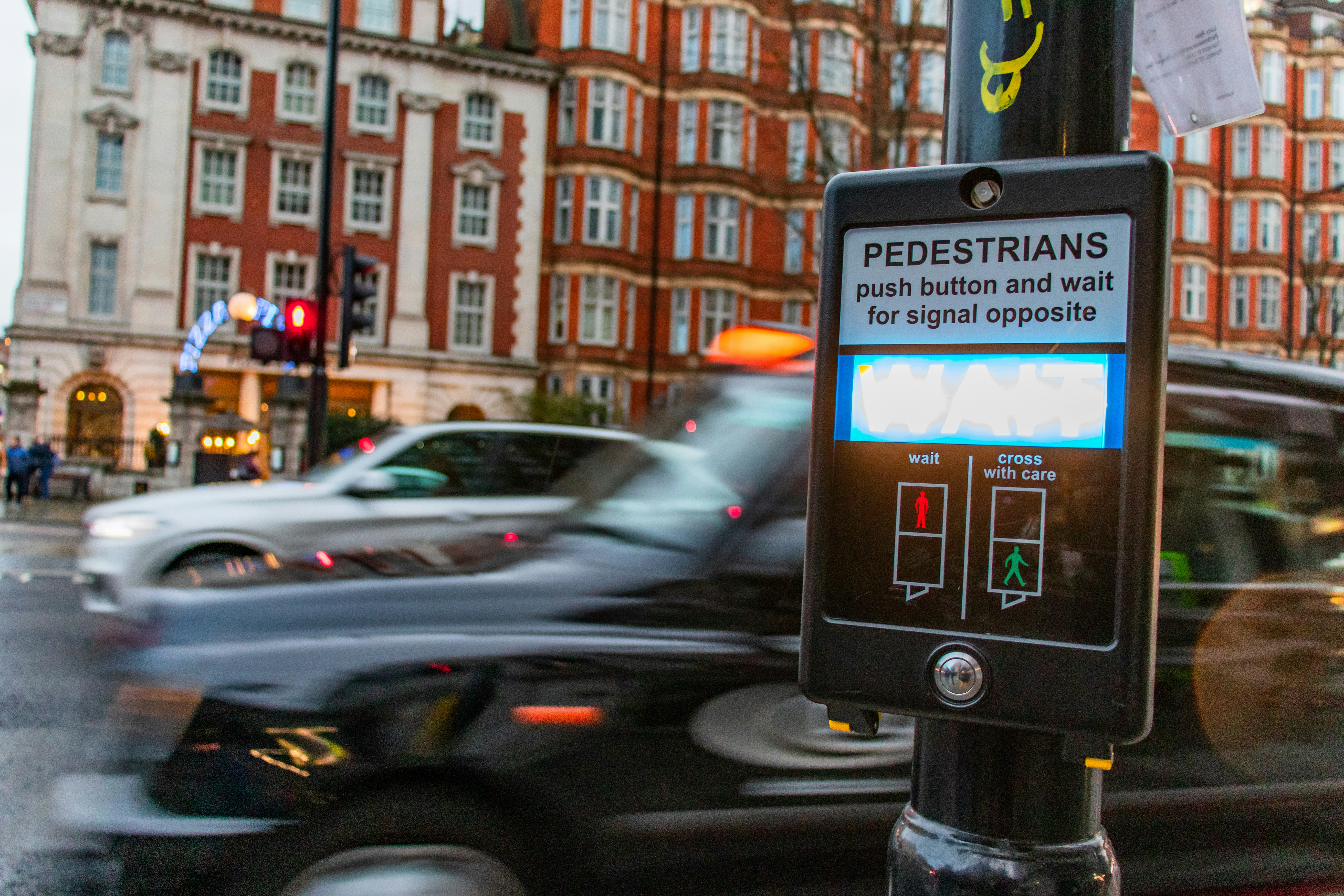 a busy road with a first time taxi driver driving a taxi