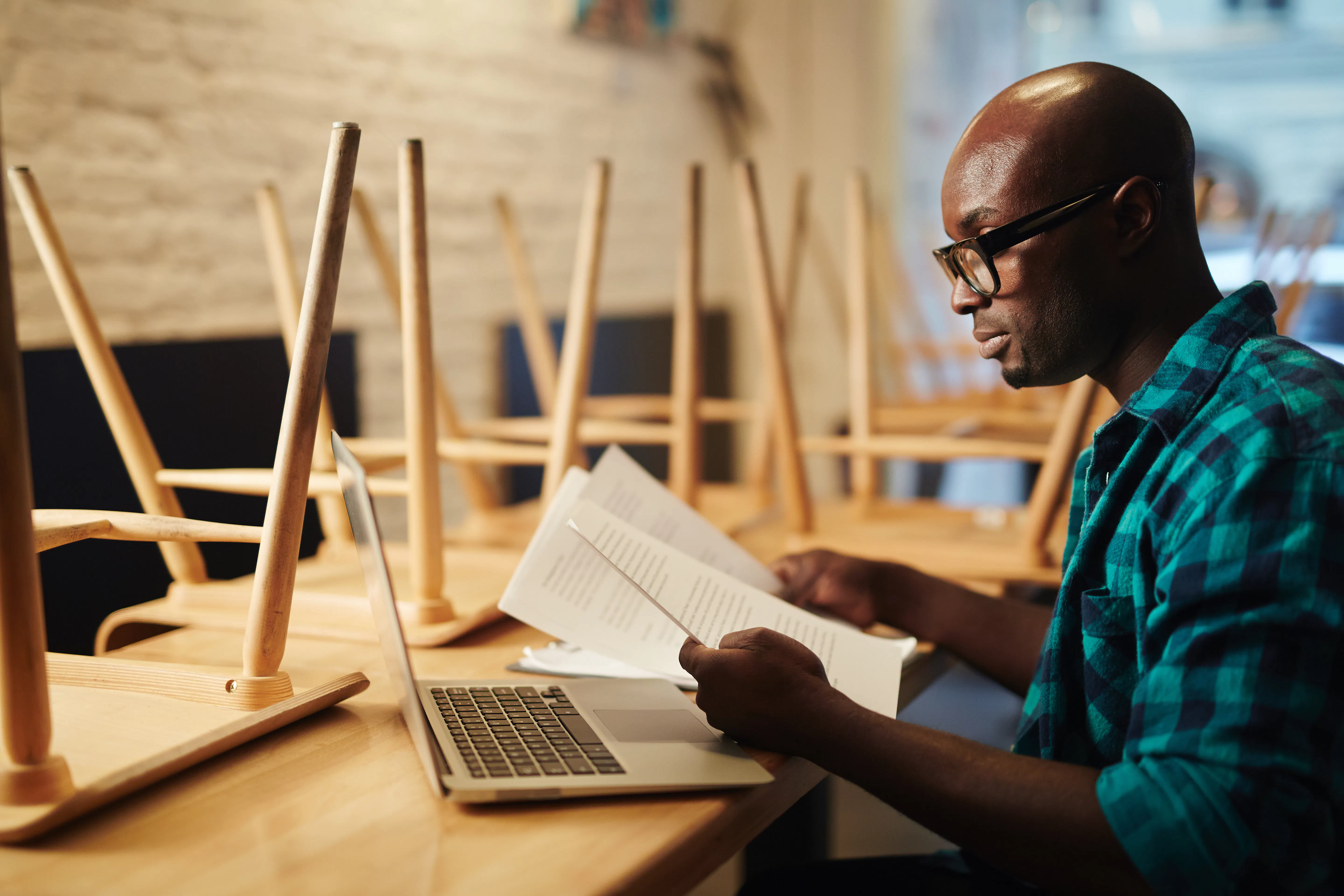 a landlord reading up of legal documents relating to rent a property